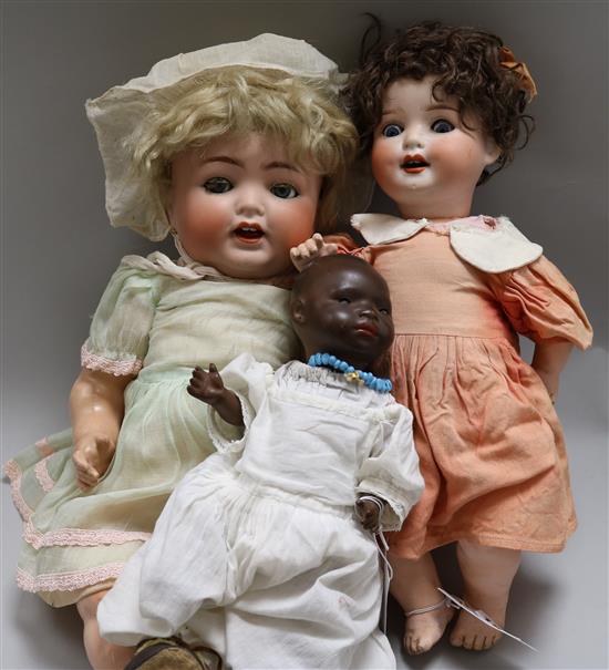 Three Heubach Koppelsdorf bisque head dolls; 399.12/0 black baby doll, 342.6.5 and 300.0